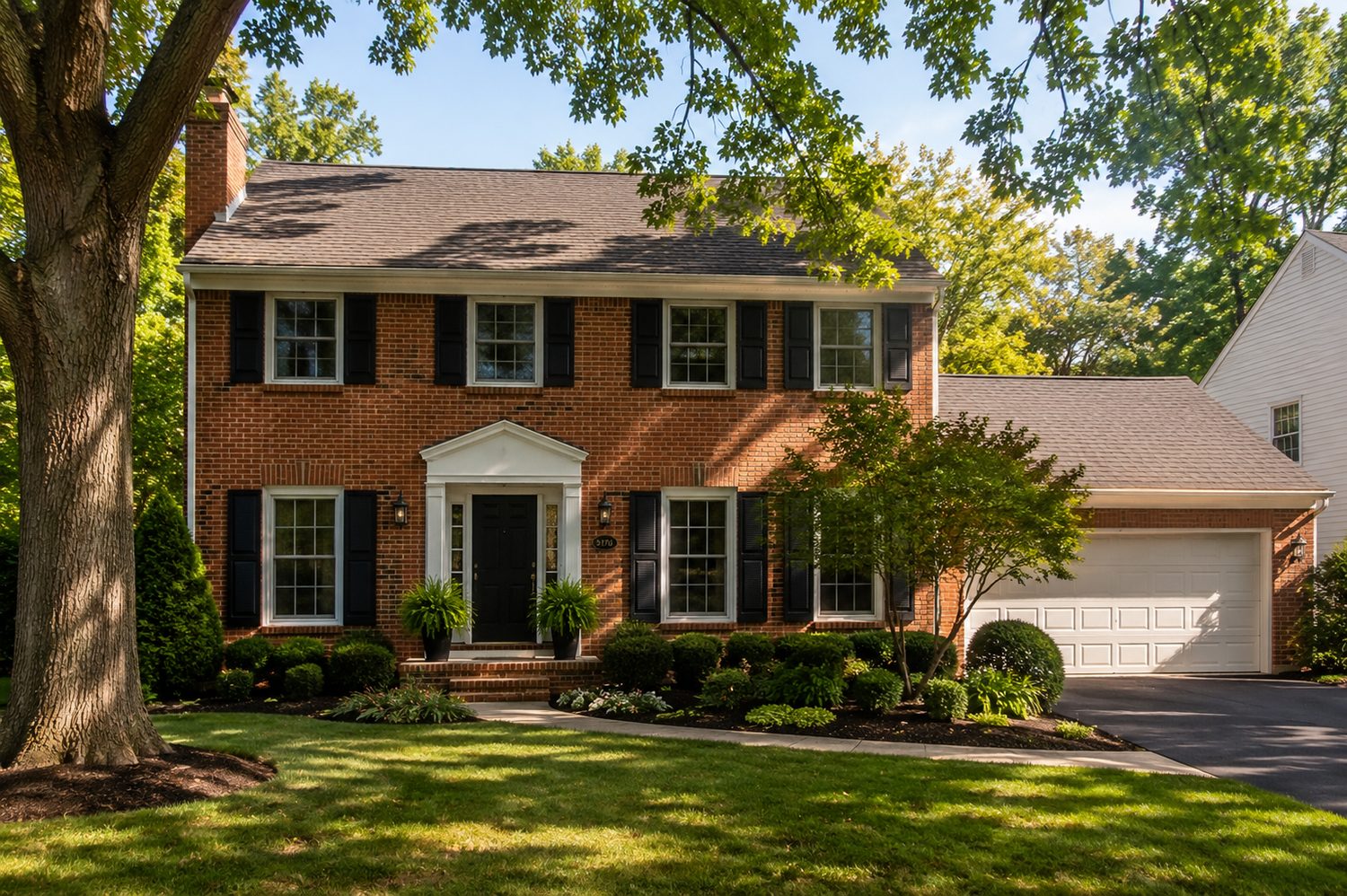 Brick colonial at dusk